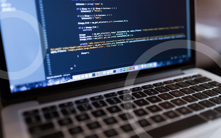 laptop with computer code